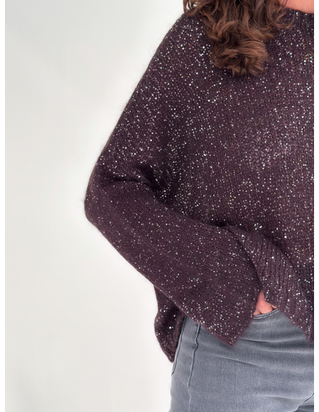 Cut-out sweater embellished with sequins and a jeweled button