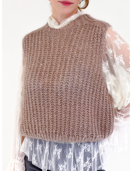 Lightweight sheer lace top adorned with romantic ruffle details