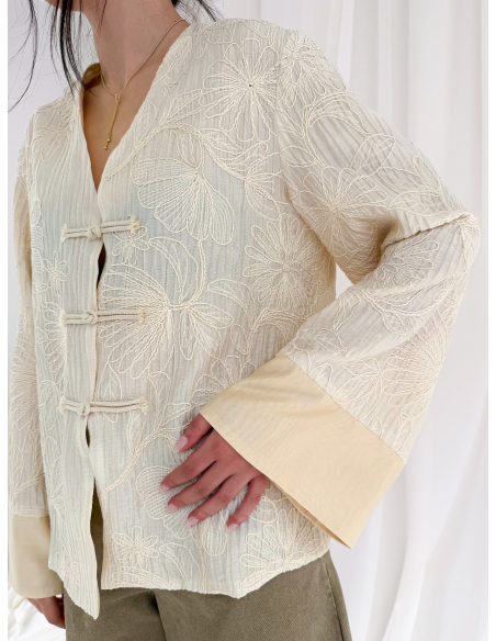 Jacket embroidered with frogs