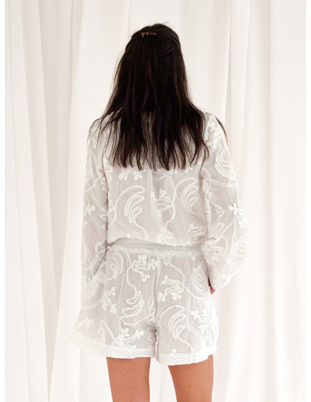 Blusa in cotone con ricami floreali