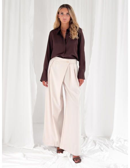 Tailored trousers with asymmetrical pleats